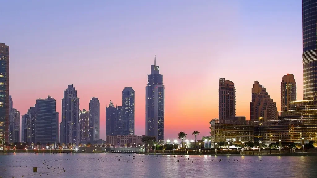 Dubai skyline at sunset with waterfront buildings
