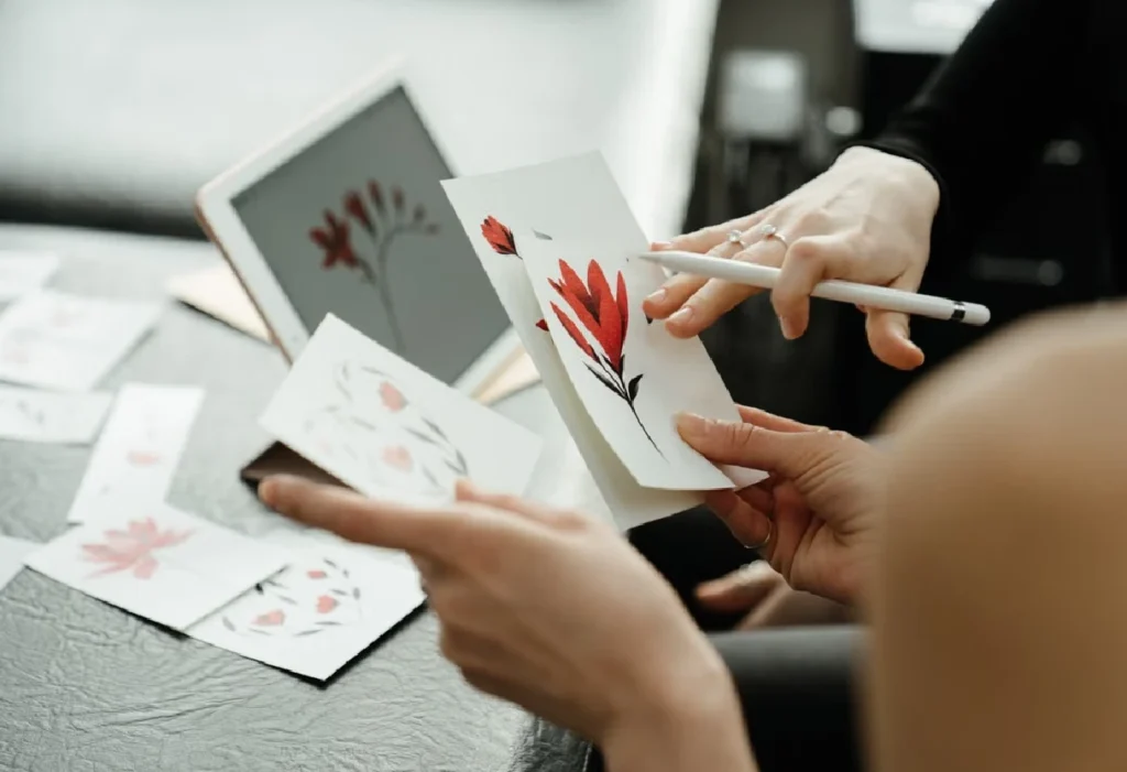 Designer creating floral artwork on a tablet