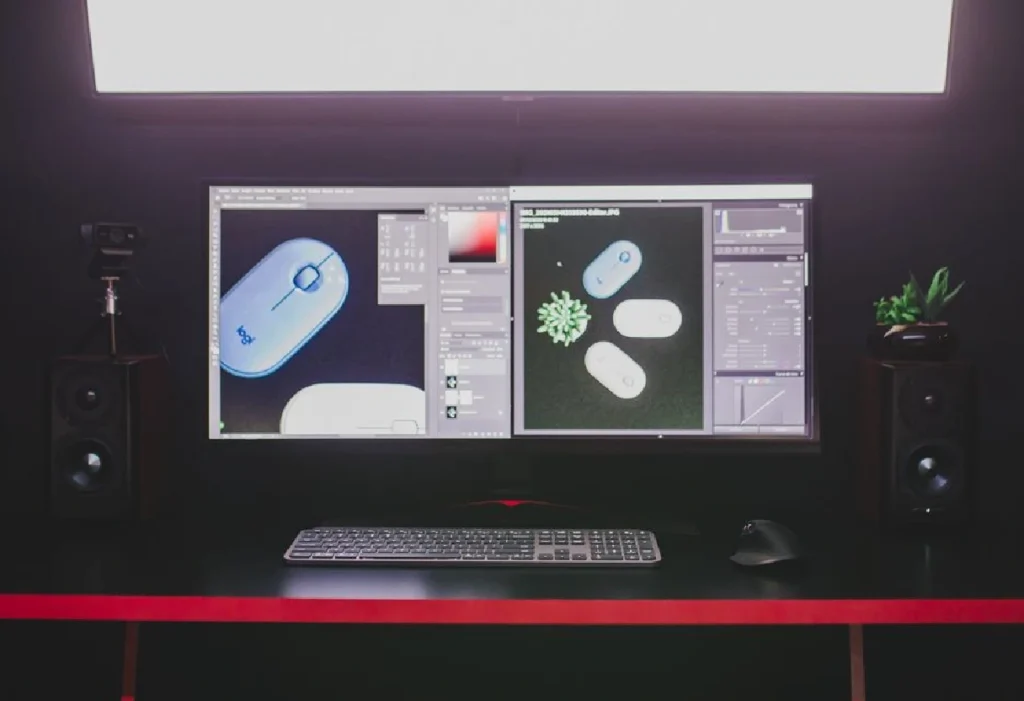 3D product designs displayed on dual monitors