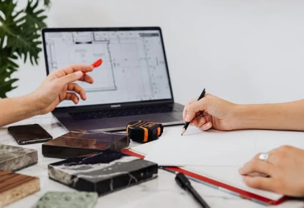 Architects reviewing a building design on a laptop