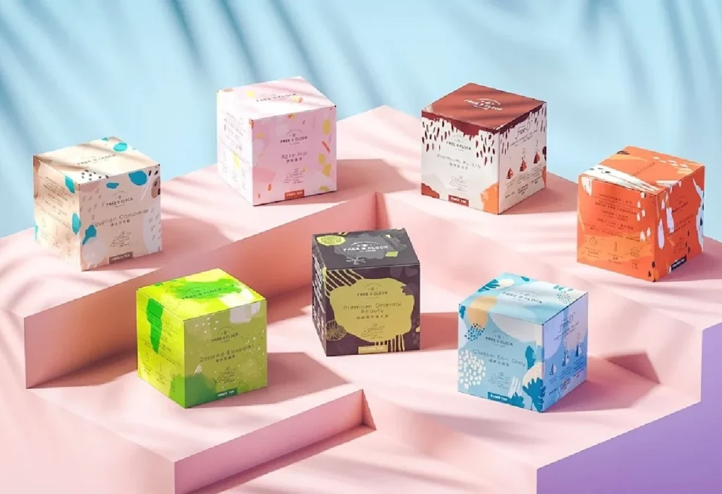 Colorful product packaging boxes on a pink display